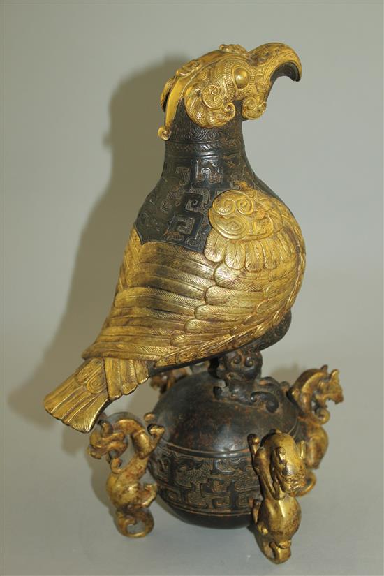 A Chinese part gilt bronze model of an eagle, in Han dynasty style, 29.5cm